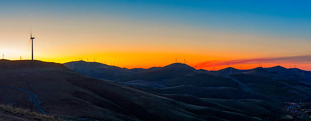 Free Stock Photo of Sunset over rolling hills with wind turbines ...