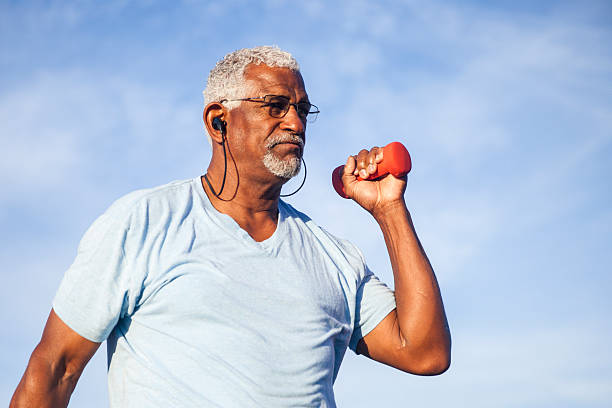 istock Senior Black Man Exercising Outdoors with Dumbells 627126714