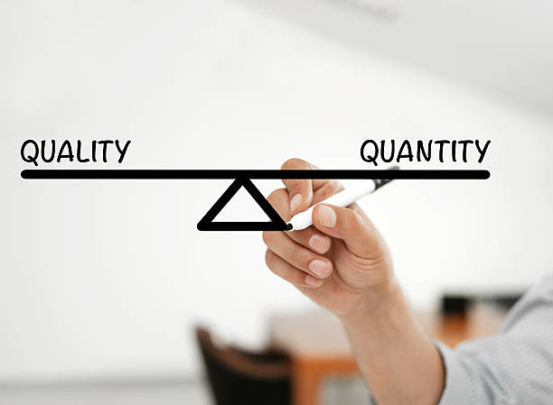 quality and quantity balance Businessman drawing a balance bar saying"quality and quantity" abundance stock pictures, royalty-free photos & images
