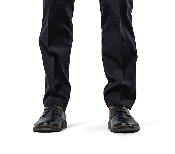 front view cropped legs of businessman isolated on white background - business human foot shoe men imagens e fotografias de stock