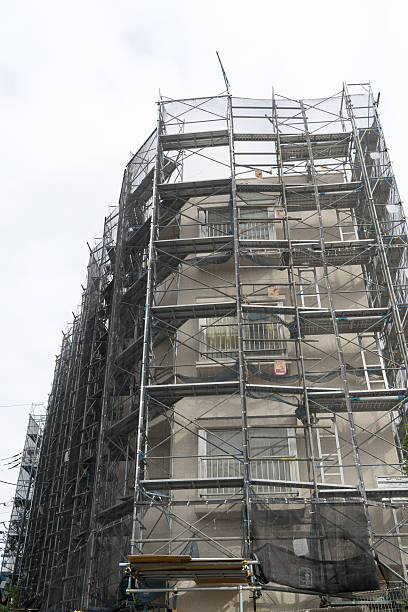 istock Japanese buildings undergoing repair work enclosed by scaffolds. 3 627141170