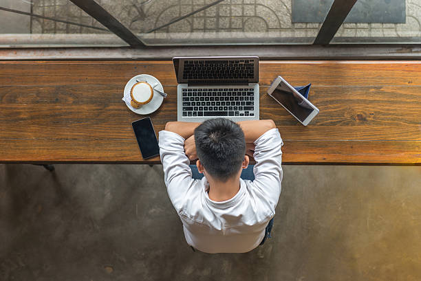 istock The man sitting with laptop, smartphone and tablet at cafeteria 627141756