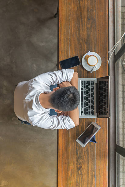 istock Young men sleeping beside laptop, tablet and smartphone 627141810