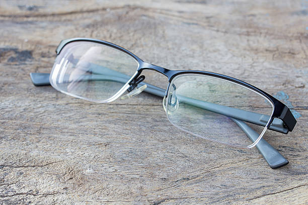 istock glasses lie on the dark wooden table. 627147176