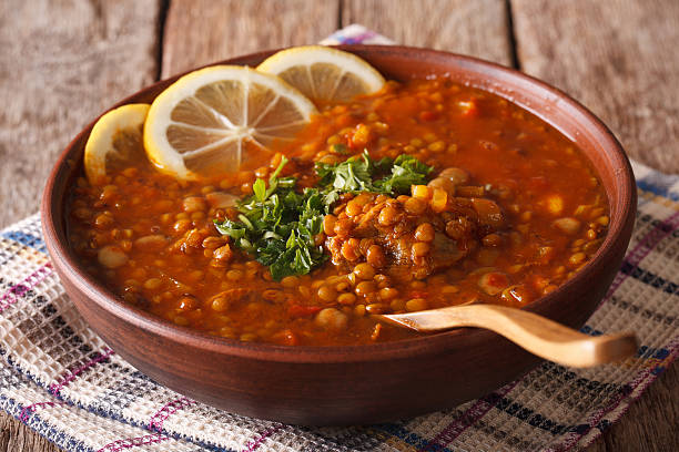Thick Moroccan soup in a bowl close-up on the table Thick Moroccan Harira soup in a bowl close-up on the table. Horizontal soup lentil healthy eating dishware stock pictures, royalty-free photos & images