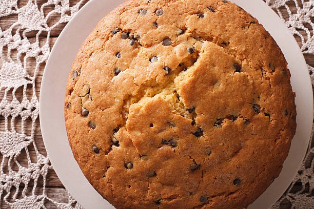 istock Freshly baked biscuit cake with chocolate chips macro. horizontal 627149024