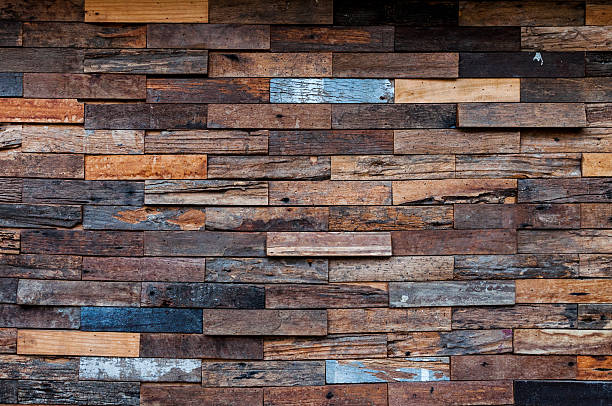 istock exposed wooden wall exterior, patchwork of raw wood forming 627149938