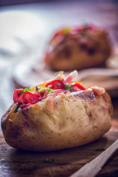 istock Baked Potato with Sour Cream, Bacon and Chili 627157536