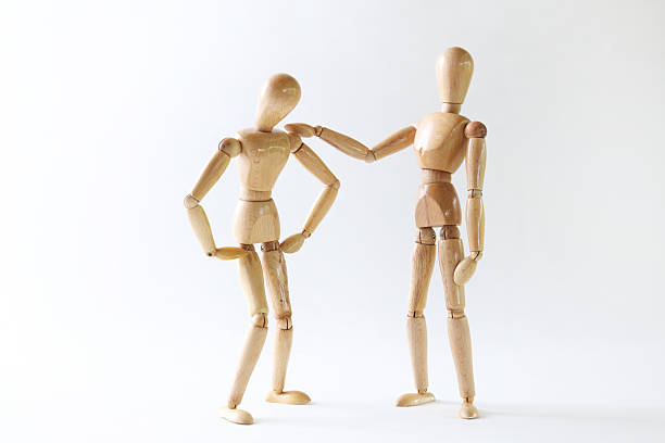 istock Wooden doll posing trouble on white background 627157638