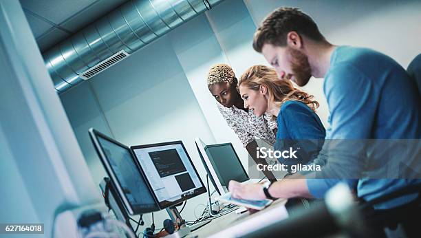 Application Developers At Work Stock Photo - Download Image Now - Technology, IT Support, Teamwork