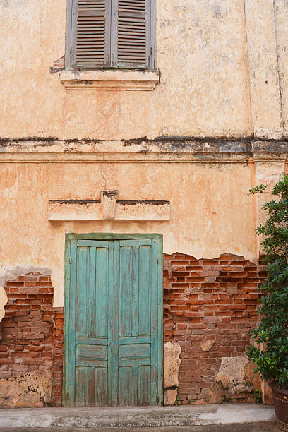 Old building with green old door stock photo