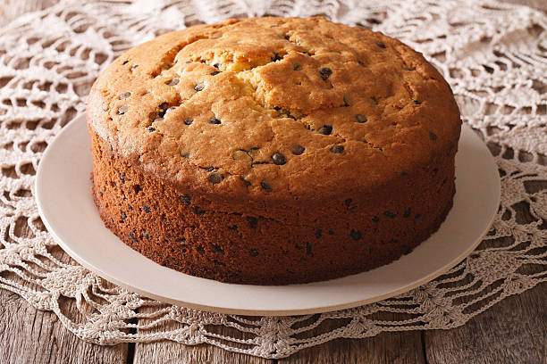 Freshly baked biscuit cake with chocolate chips close-up Freshly baked biscuit cake with chocolate chips close-up on the table. horizontal torte photos stock pictures, royalty-free photos & images