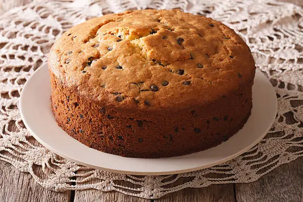 Freshly baked biscuit cake with chocolate chips close-up on the table. horizontal