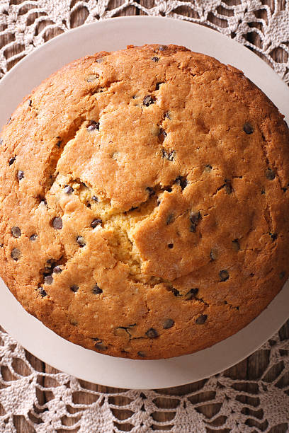 istock Freshly baked biscuit cake with chocolate chips macro. vertical 627170874
