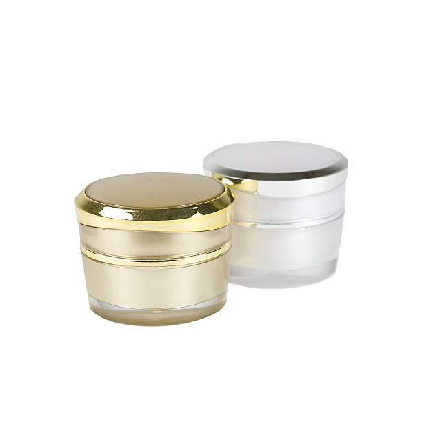 istock gold and silver container of cream 627176578