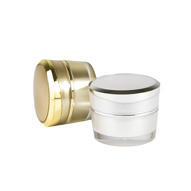 istock gold and silver container of cream 627176590