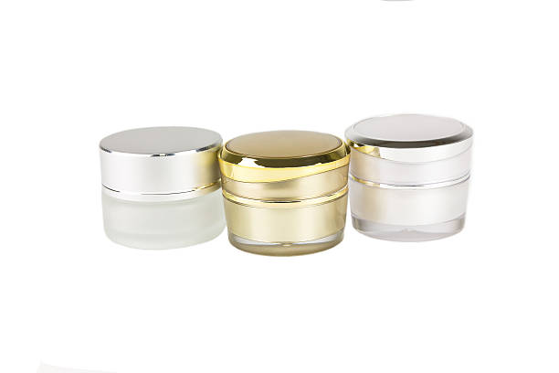 istock gold and silver container of cream 627176618