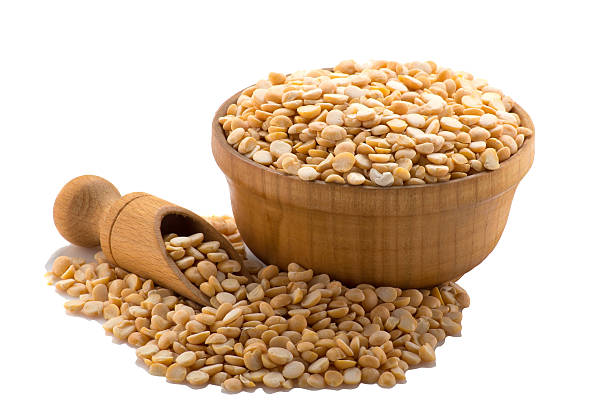 istock Yellow peas in a wooden bowl with a spatula 627177874