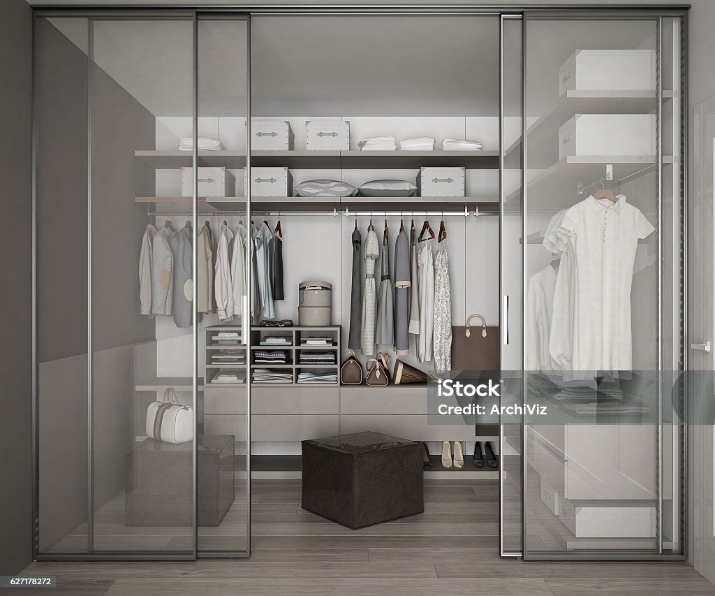Classic walk in closet with glass sliding doors Closet Stock Photo