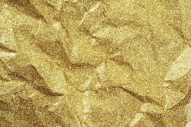 istock Gold wrinkled paper texture abstract background 627183396