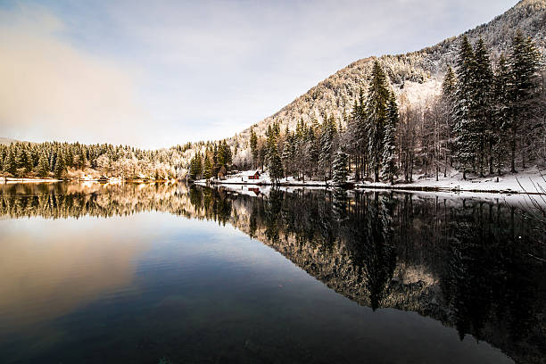 istock first snow at the mountain lake 627184992