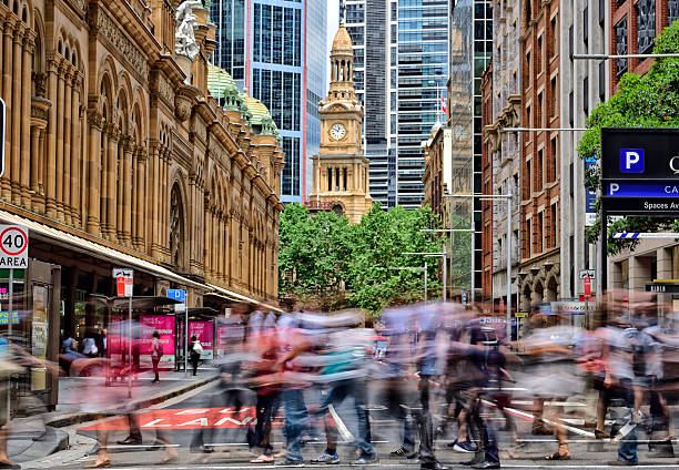 people crowd crossing street in central sydney - sydney australia imagens e fotografias de stock