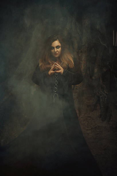 istock Dark witch casts a spell model big, beautiful woman. 627196072