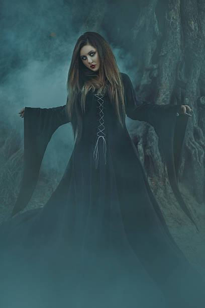 istock Dark witch casts a spell model big, beautiful woman. 627196146