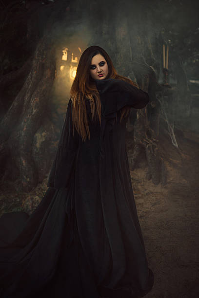 istock Dark witch casts a spell model big, beautiful woman. 627196168