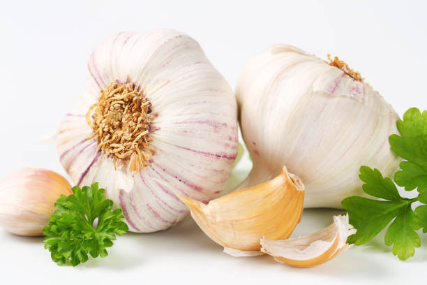 istock Fresh garlic bulbs and cloves 627196750
