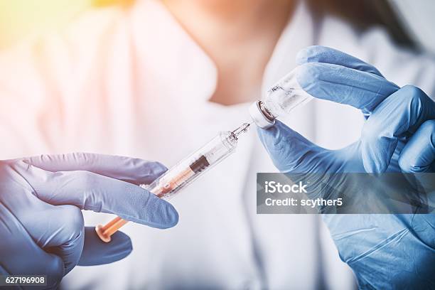 Injecting Injection Vaccine Vaccination Medicine Flu Woman Docto Stock Photo - Download Image Now