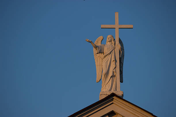 istock catholic church with angel statue 627198014