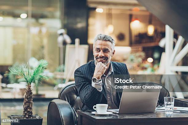 Mature Businessman Working In Comfort Stock Photo - Download Image Now - Businessman, CEO, Men