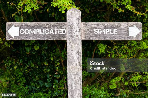 Simple Versus Complicated Directional Signs Stock Photo - Download Image Now - Complexity, Sparse, Choice