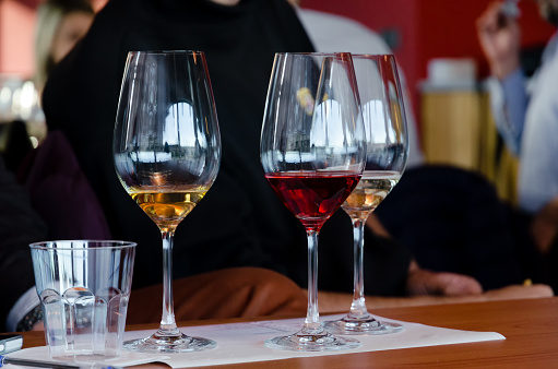 Wine tasting experience in Langhe (Italy) with three glasses of Moscato and Brachetto on a table