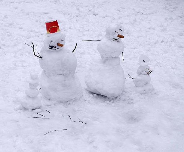 istock Family snowmen of four figures 627201258