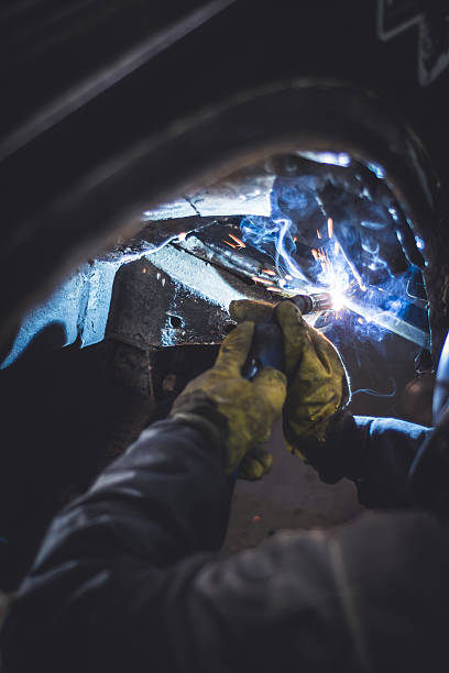 istock Mechanic welding on a car in an auto service 627202768