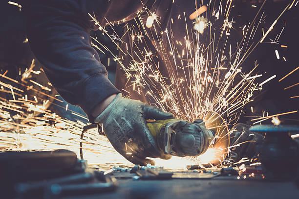 istock Angel grinder makes a flash of sparks while cutting 627203634