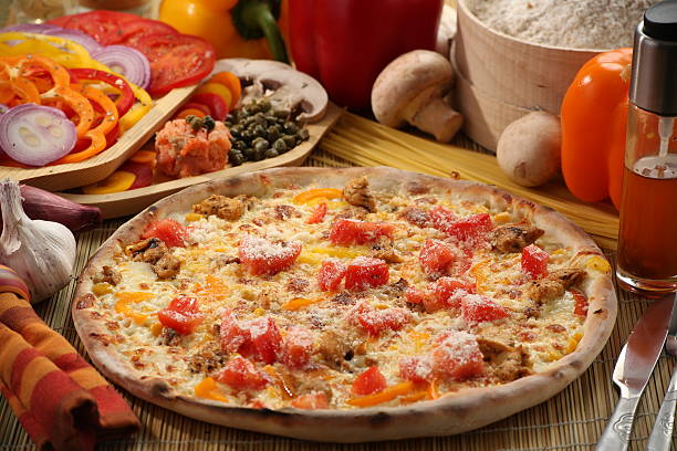 istock Food setup with pizza and vegetables 627210782