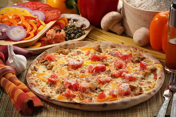 istock Food setup with pizza and vegetables 627210882