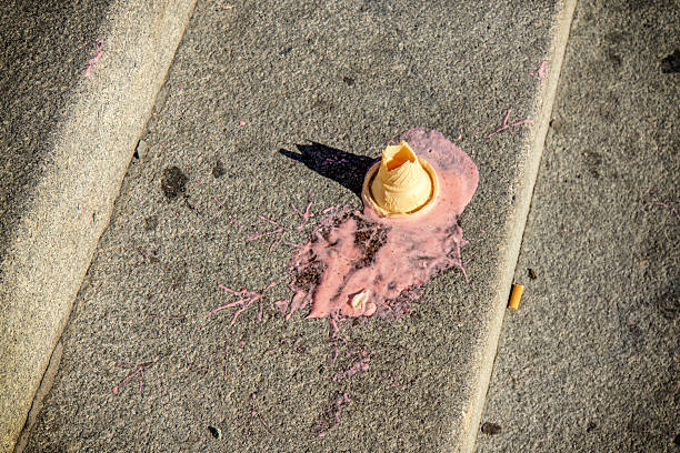 istock Melting ice cream cornet dropped on the street 627216490