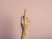 Female hand showing rude gesture