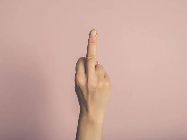 Photo of Female hand showing rude gesture