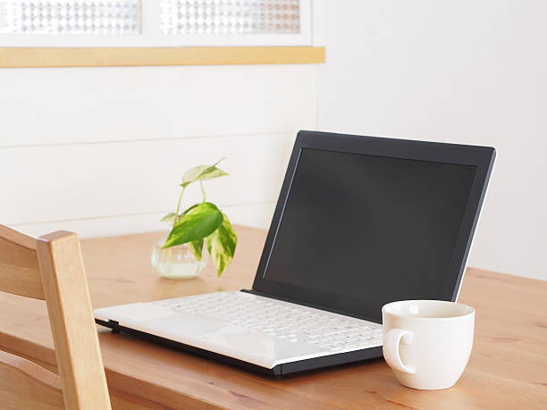 istock laptop on a wooden table 627218916