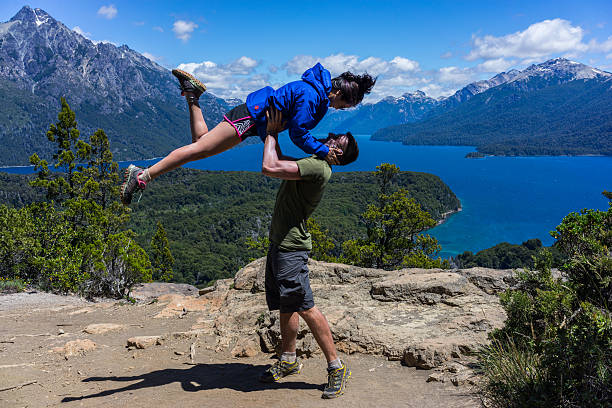 Couple posing in San Carlos de Bariloche.  Patagonia, Argentina Posing in front of the beautiful mountains and lakes of the Patagonia region of Argentina chile tourist stock pictures, royalty-free photos & images