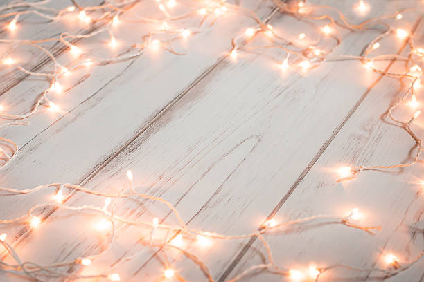 istock Christmas lights wooden background 627219558