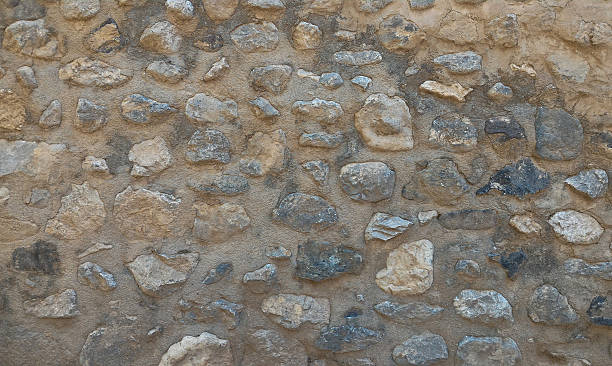kamienna faktura ściany. tło skalne. - stone rock river pebble zdjęcia i obrazy z banku zdjęć