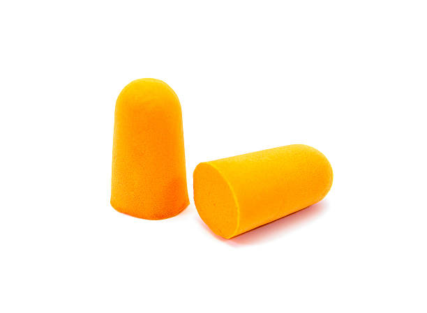 istock Ear plugs isolated on white background.Orange ear plugs isolated 627227504