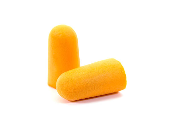 istock Foam ear plugs isolated on white background.Orange ear plugs isolated 627227616