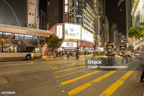 Blurred Motion People Crossing Road On Yellow Zebra Hong Kong Stock Photo - Download Image Now